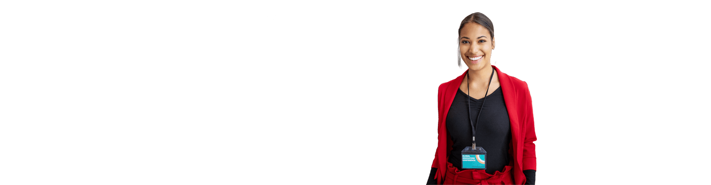 Conference attendee wearing red jacket and lanyard with name card