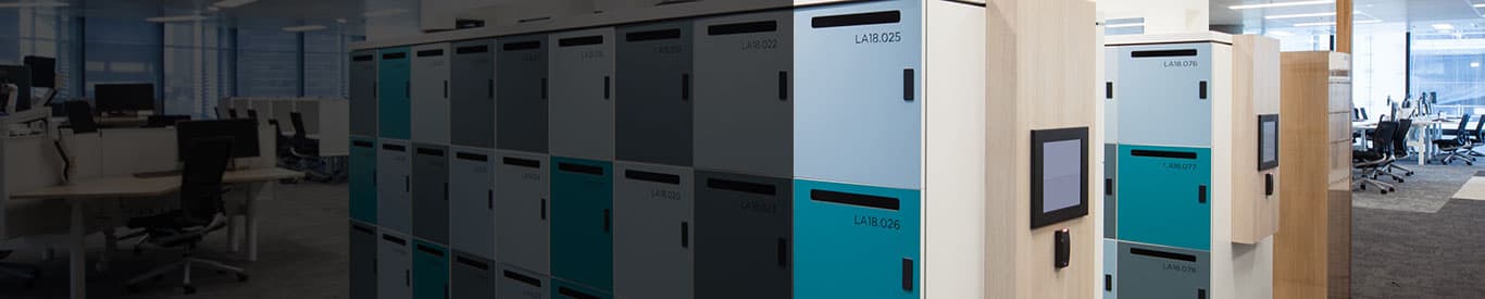 woman interacting with locker kiosk to retreive contents